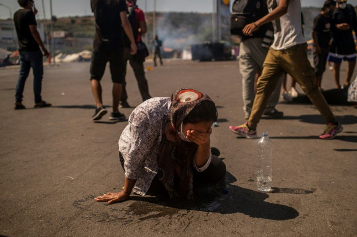 Some people suffering from respiratory problems because of the tear gas were taken away by ambulances, according to the migrants.Â