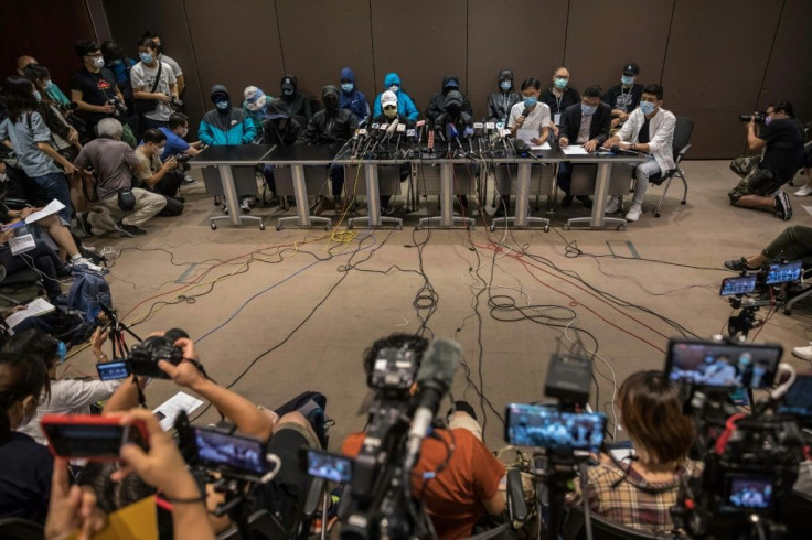 Lawmakers and relatives of 12 Hong Kongers detained in China after being arrested for reportedly trying to flee to Taiwan, attend a press conference in Hong Kong