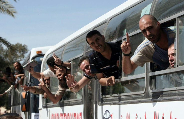 Palestinian prisoners cross into the Gaza Strip following their release from Israeli jails in the last exchange between the two sides in October 2011