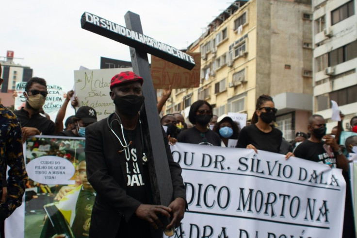 Several hundred demonstrators marched in Angola's capital over the death of a doctor detained by police for not wearing a mask