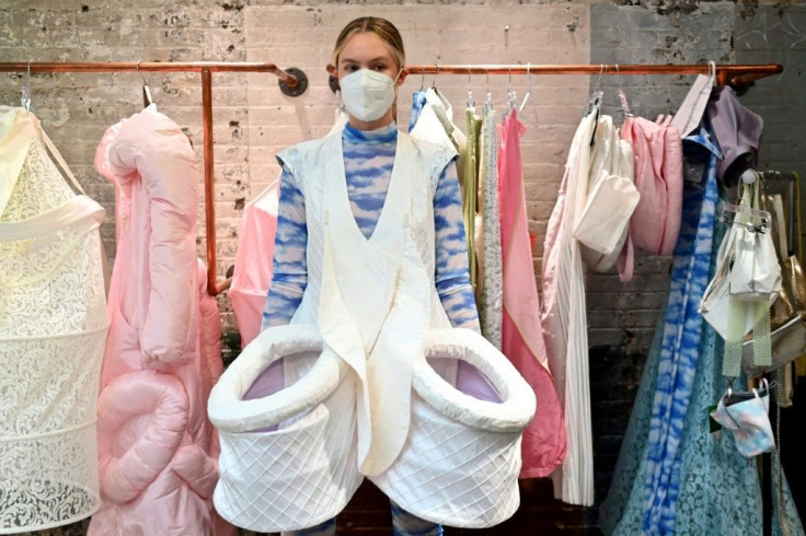 A model gets fitted during a NYFW behind-the-scenes fitting day for a Flying Solo runway show featuring a collective of local designers