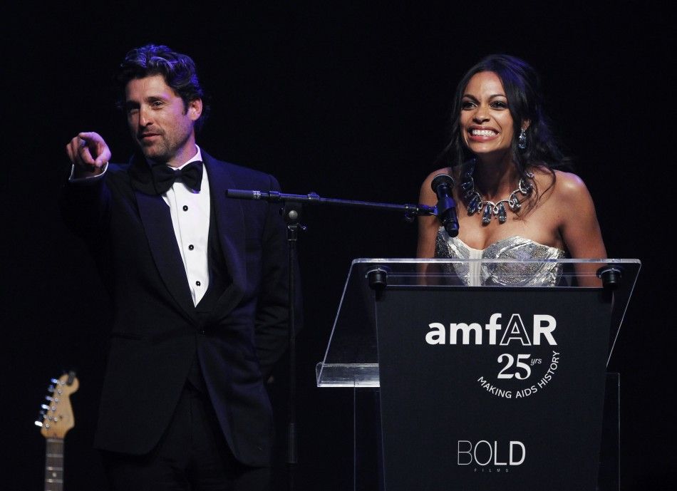 Actor Patrick Dempsey L and actress Rosario Dawson R attend an auction during the amfAR039s Cinema Against AIDS 2011 event in Antibes during the 64th Cannes Film Festival May 19, 2011.
