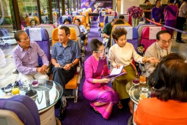At the headquarters of Thai Airways in Bangkok, diners appear even to have missed plane food as they gobble up spaghetti carbonara served on plastic trays by cabin crew
