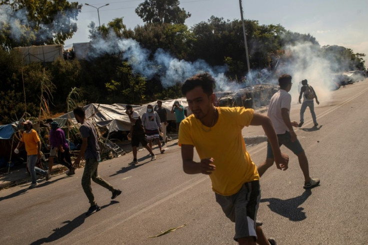 Police responded with tear gas after protesters threw stones