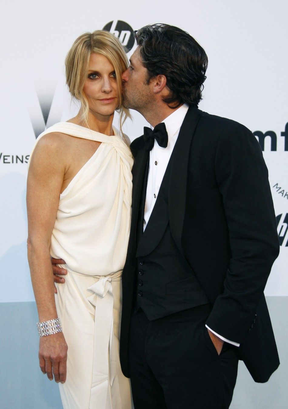 Actor Patrick Dempsey, star of the film quotEnchantedquot, poses with his wife Jillian as they arrives for amfARs Cinema Against AIDS 2011 event in Antibes during the 64th Cannes Film Festival May 19, 2011.