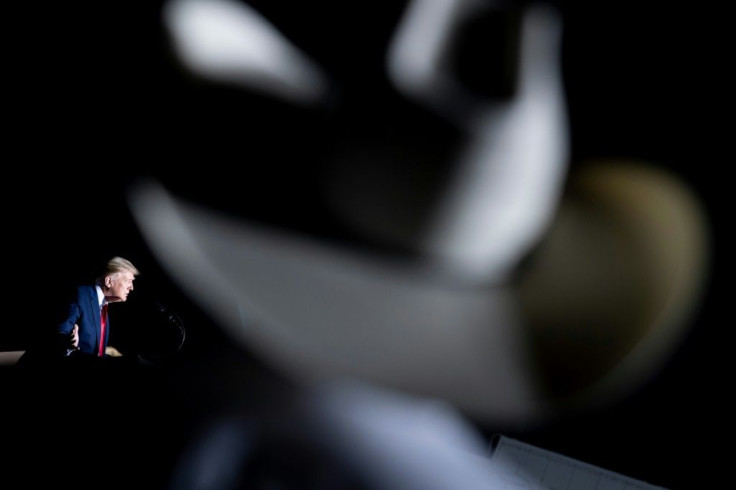 US President Donald Trump plays up his connection with the crowd during a campaign rally in Minden, Nevada on September 12, 2020