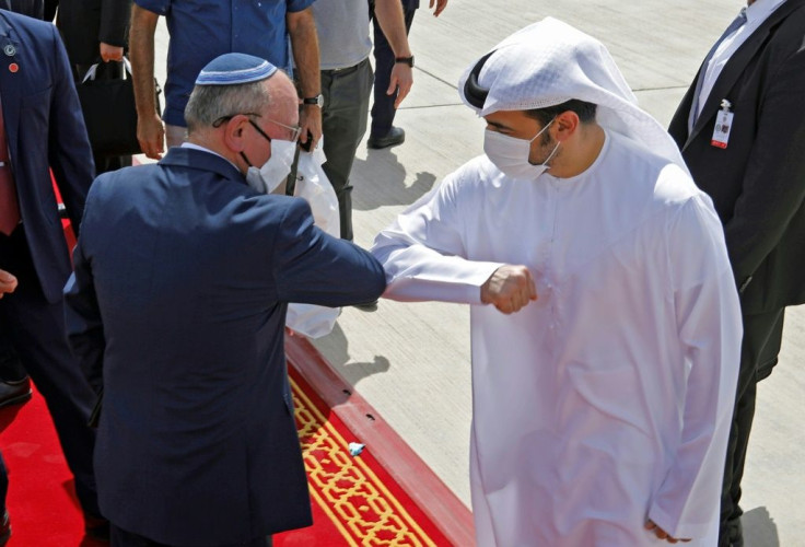 Israeli National Security Advisor Meir Ben-Shabbat bumps elbows with an UAE official after a brief visit to Abdu Dhabi