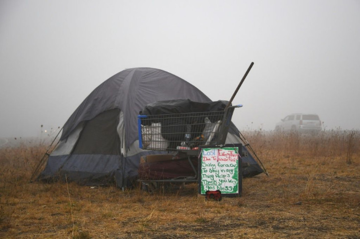A sign in front of a tent along the highway near Salem, Oregon on September 13, 2020 reads "Lost Everything Due To House Fire"