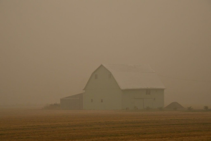 A barn is shrouded in smoke on September 13, 2020 in Molalla, Oregon, which has been evacuated due to the Riverside Fire