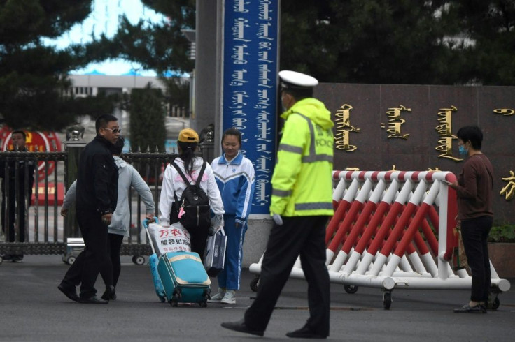 Students arrive at the Tongliao Mongolian Middle School in Tongliao, China's northern Inner Mongolia region, following recent protests over a new bilingual education policy by the Chinese government