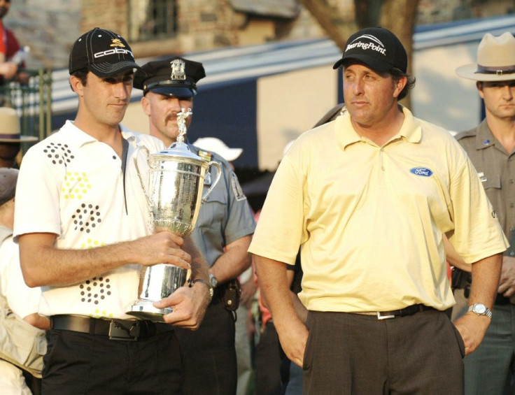 Geoff Ogilvy holds the trophy after winning the US Open at Winged Foot in 2006 as Phil Mickelson looks ruefully on