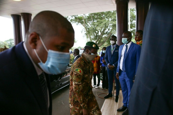 The head of the Malian military junta, Col. Assimi Goita, centre, arriving in Ghana for the ECOWAS summit