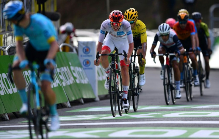 Slovenia's Tadej Pogacar wearing the best young's white jersey chasing Miguel Angel Lopez