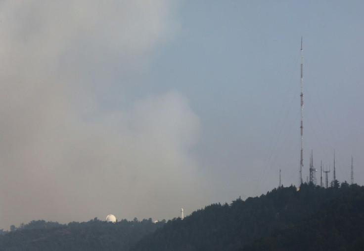 Smoke rises behind the Mount Wilson Observatory as the Bobcat Fire burns in the Angeles National Forest on September 14, 2020 near Pasadena, California