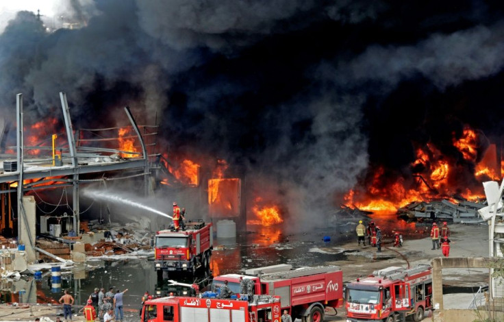 Lebanese firefighters try to put out a fire that broke out at Beirut's port area, on September 10