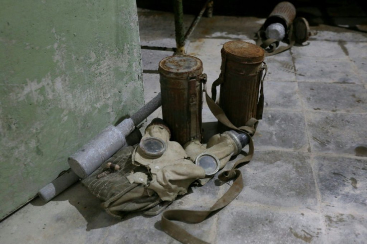 The tunnel walls are now crumbling and old military equipment and furniture left behind is covered in dust