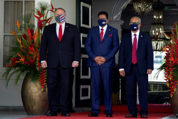 US Secretary of State Mike Pompeo (left) stands next to Suriname's President Chan Santokhi (center) and Foreign Minister Albert Ramdin at the presidential palace in Paramaribo