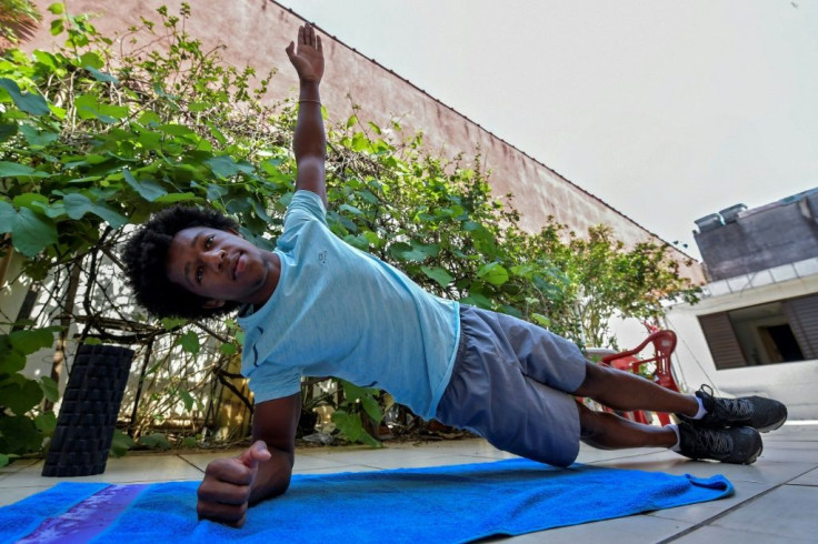Angelo Assumpcao says he was regularly mocked by fellow gymnasts for his skin color, hair and Afro-Brazilian heritage