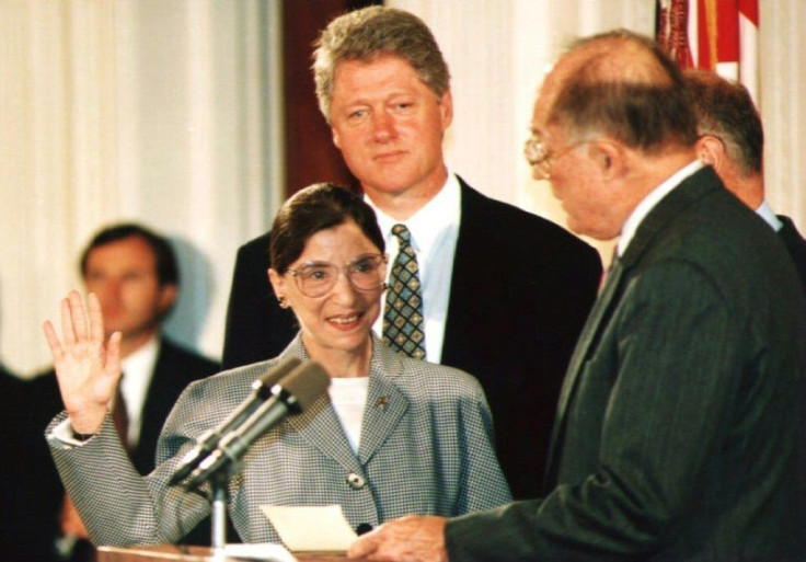 US Supreme Court chief justice William Rehnquist (R) administers the oath of office to newly-appointed Justice Ruth Bader Ginsburg (L) in August 1993 as then president Bill Clinton looks on