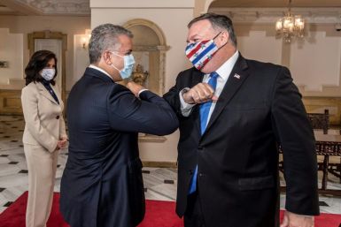 Colombian President Ivan Duque (L) and US Secretary of State Mike Pompeo greeting each other with an elbow bump at Narino Presidential Palace in Bogota