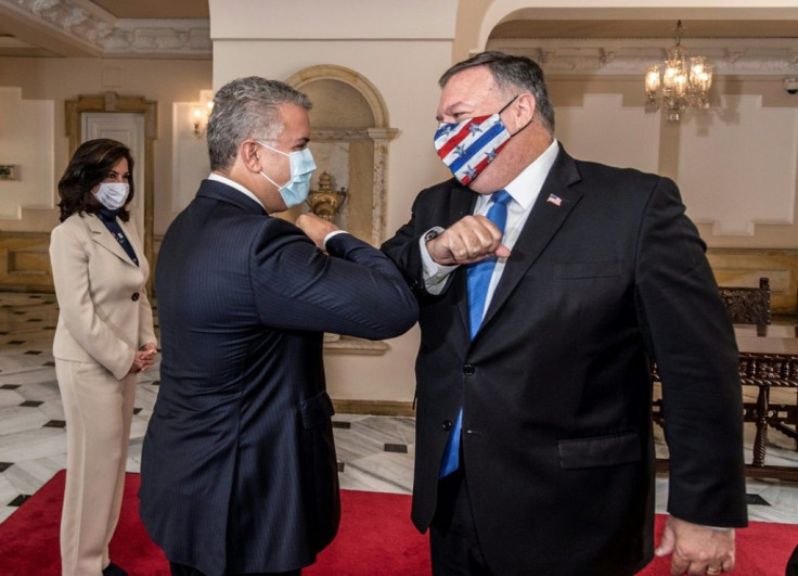 Colombian President Ivan Duque (L) and US Secretary of State Mike Pompeo greeting each other with an elbow bump at Narino Presidential Palace in Bogota