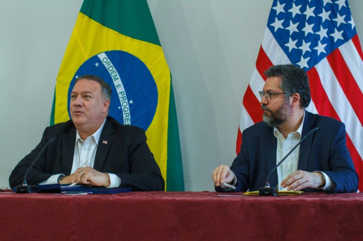 Pompeo (L) with Brazi's Foreign Minister Ernesto Araujo at the Boa Vista Air Base in Brazil