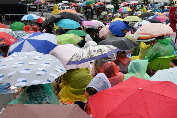 Demonstrators rallying in Bangkok's historic Sanam Luang field on September 19, 2020 braved near-constant rainfall under a sea of umbrellas