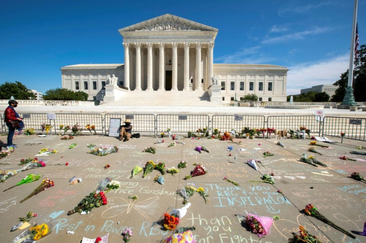 Messages and flowers are left outside of the US Supreme Court in memory of Justice Ruth Bader Ginsburg, in Washington, DC, on September 19, 2020