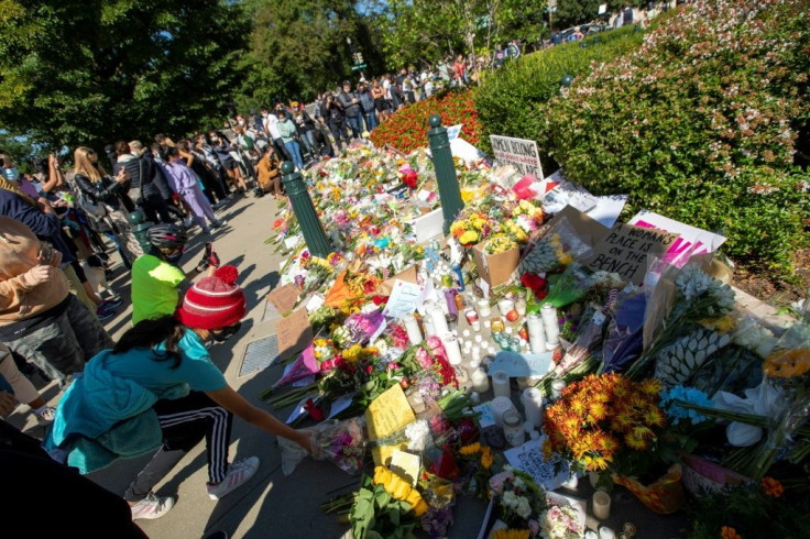 People leave  flowers outside of the US Supreme Court in memory of Justice Ruth Bader Ginsburg, in Washington, DC, on September 19, 2020