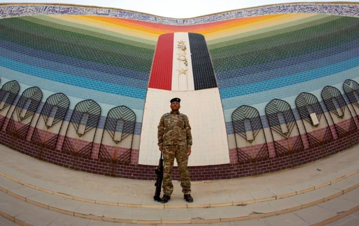 Four decades after the Iran-Iraq war began, Tehran has close allies in Baghdad's halls of power -- and in this photograph an Iraqi soldier stands guard at an Iraqi mosque built after the end of the conflict