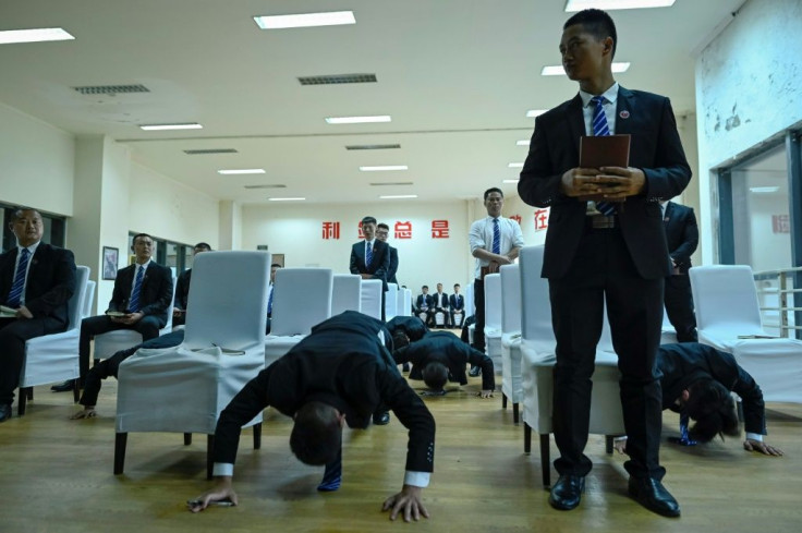 Bodyguard trainees do push-ups as punishment after they lost a debate during class
