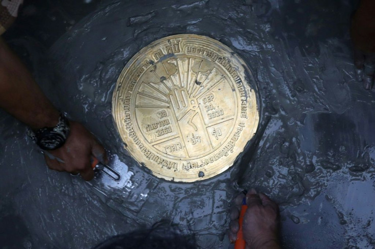 Thai pro-democracy protesters installed a plaque in Bangkok's historic Sanam Luang field, next to the Grand Palace