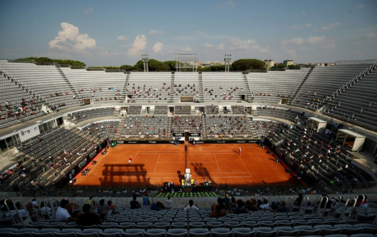 Socially-distanced fans watched Novak Djokovic (R) reach a 10th Rome final