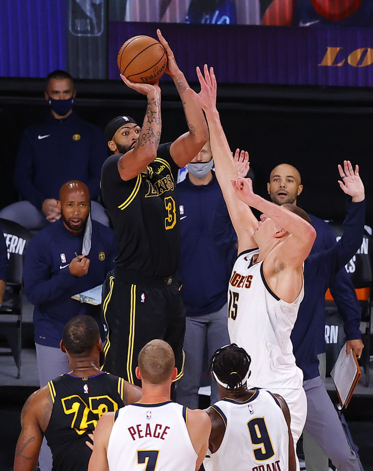 Anthony Davis #3 of the Los Angeles Lakers shoots a three point basket to win the game over Denver Nuggets in Game Two of the Western Conference Finals during the 2020 NBA Playoffs 