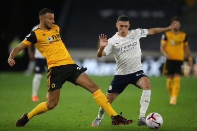 Manchester City midfielder Phil Foden (R) scored in his side's win at Wolves