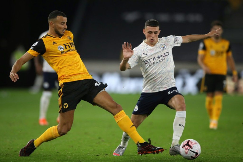 Manchester City midfielder Phil Foden (R) scored in his side's win at Wolves