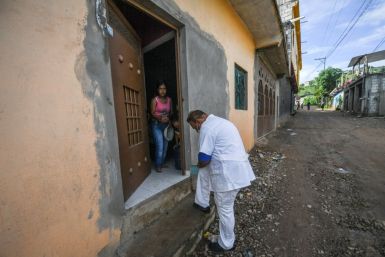 A health worker goes door to door looking for people with coronavirus symptoms in Tlapa de Comonfort in the southern state of Guerrero