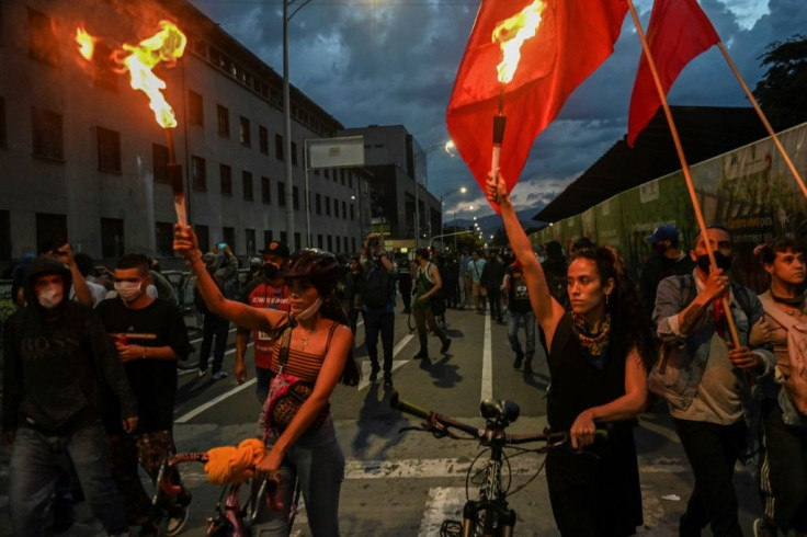 Demonstrators protest against police brutality, in Medellin, Colombia. More than 100 rallies and marches took place across the country