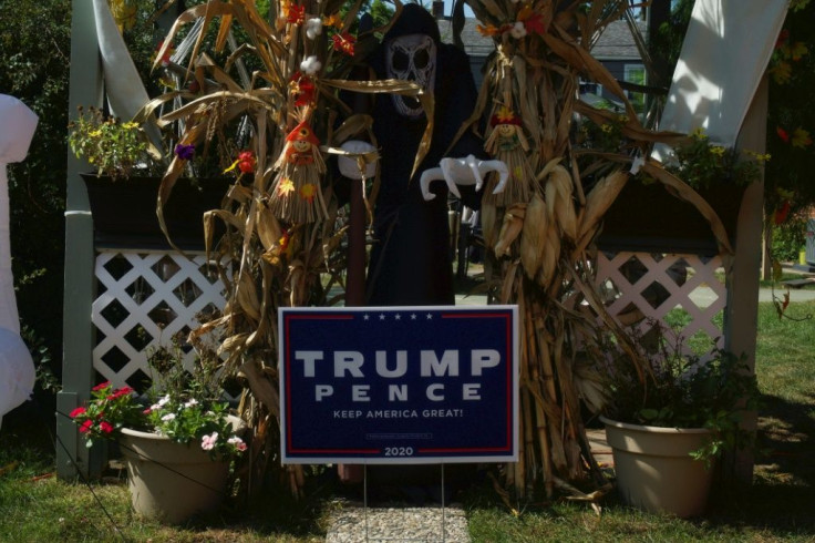 A Trump yard sign and Halloween decorations outside the house of Trump supporter Michelle Burns in Monroe, Michigan