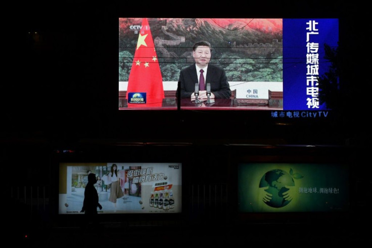 Chinese President Xi Jinping appears on an outdoor screen in Beijing as he speaks by video link at the United Nations General Assembly