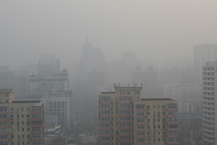 Buildings are barely visible on a polluted day in Beijing in January 2020