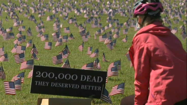 Volunteers from the COVID Memorial Project have placed 200,000 American flags on the National Mall as the United States crosses the  threshold of 200,000 lives lost in the COVID-19 pandemic.