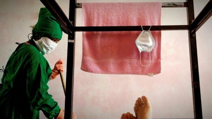 A worker cleans a room in a COVID-19 isolation center in Havana, Cuba