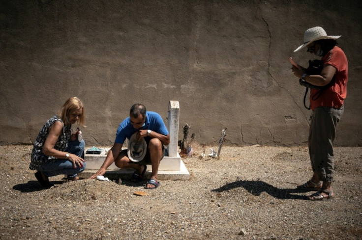 The Dargaid family, (L to R) Rahma, 70, Abdelkader, 65, and Abessia, 68, traced their twin baby brothers' graves, after decades of not knowing where they had been buried