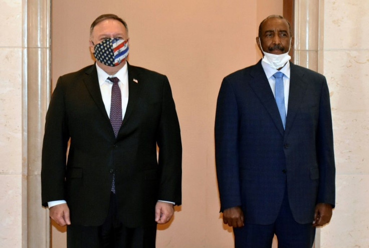 US Secretary of State Mike Pompeo poses for a picture with Sudan's top general Abdel Fattah al-Burhan in Khartoum on an August 2020 visit