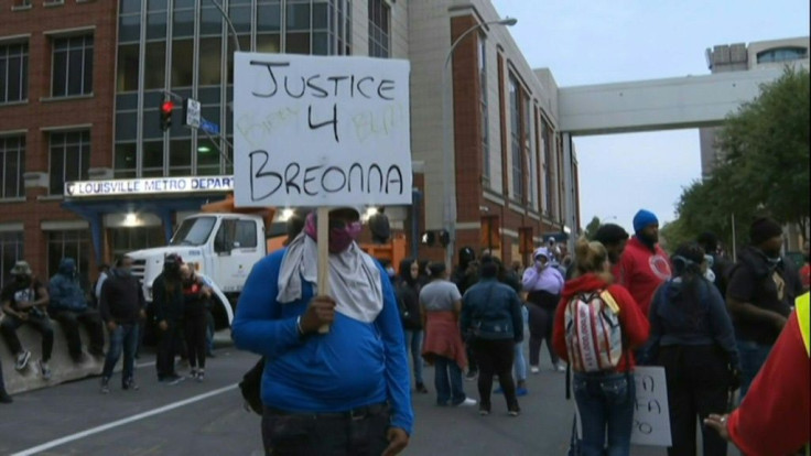 Protesters gather in downtown Louisville, Kentucky, to demand justice after charges were filed against only one officer involved in the fatal shooting of Breonna Taylor, a 26-year-old black woman whose name has become a rallying cry of the Black Lives Mat