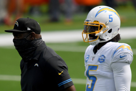 Tyrod Taylor #5 of the Los Angeles Chargers with head coach Anthony Lynn, during warm up before the game against the Kansas City Chiefs.