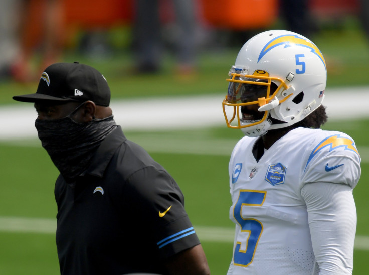 Tyrod Taylor #5 of the Los Angeles Chargers with head coach Anthony Lynn, during warm up before the game against the Kansas City Chiefs.