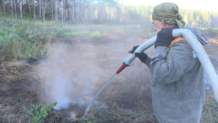 A small group of Russian volunteer firefighters in Siberia try to tackle a peat bog fire in the Suzunski nature reserve, 250 kilometres south of Novosibirsk. Smouldering more than a metre deep, this "zombie" fire can survive the harsh Siberian winters and
