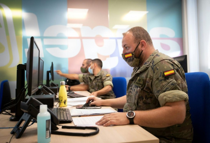 Spanish soldiers work at a coronavirus patient tracking centre in Palma de Mallorca